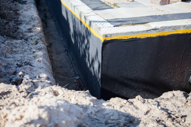 Professional Waterproofing technician working in Hutchinson, KS